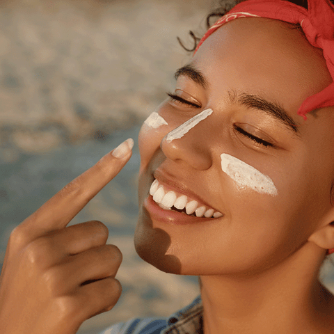 Woman applying SPF